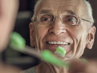 Patient in Annandale smiling with well-maintained dentures