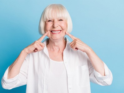 woman enjoying the benefits of dental implants in Annandale