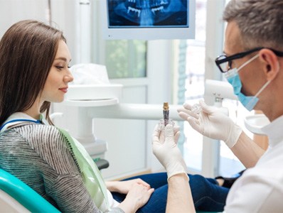 patient learning the cost of dental implants in Annandale