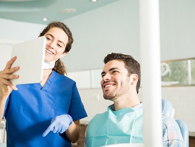 Dentist and patient discussing Invisalign in Annandale