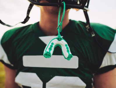 Football player with mouthguard