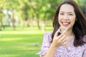 A closeup of a patient with Invisalign in Annandale