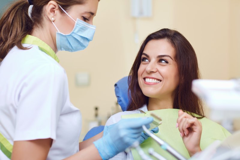 Dentist talking to patient about dental implants