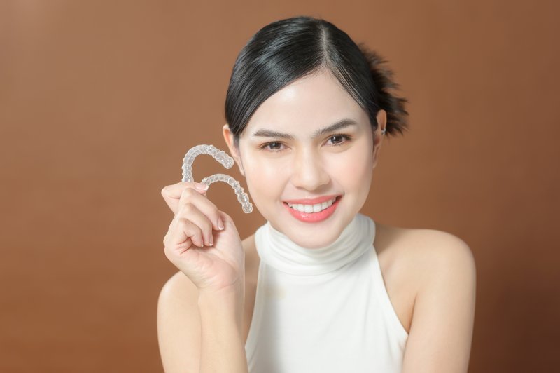 Lady shows off her Invisalign aligners